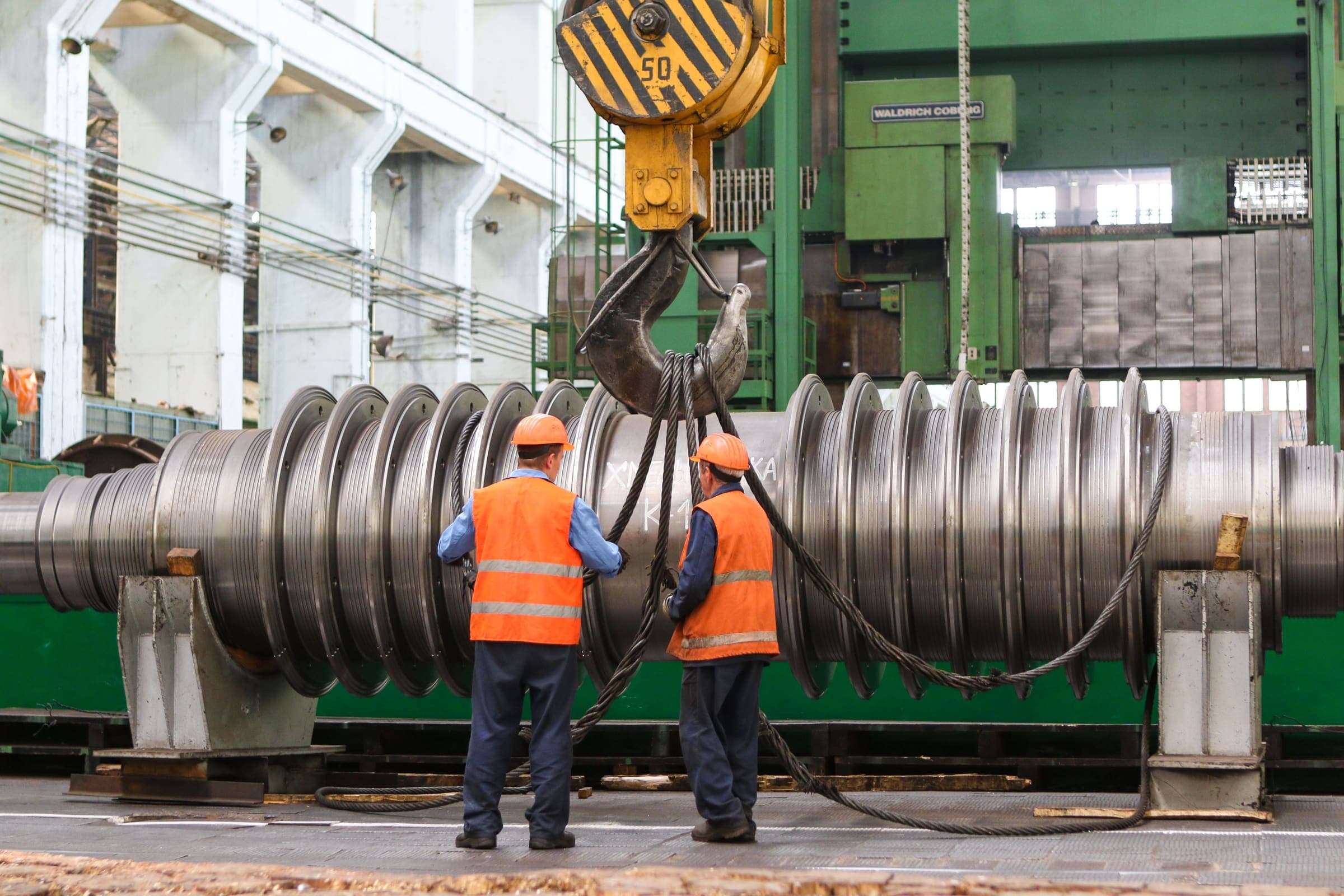 Technicians rigging a turbine rotor